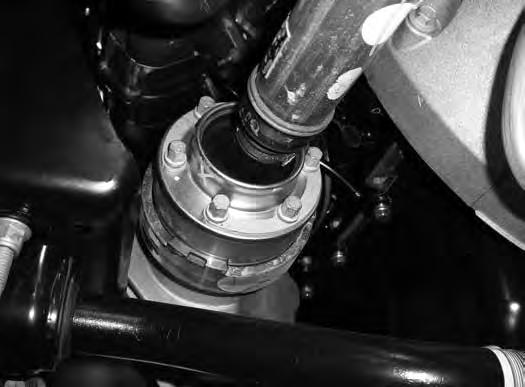 Retain hardware. 18. Mark the struts to distinguish between driver s and passenger s. 19. Remove the three strut assembly mounting nuts at the frame and remove the strut assembly from the vehicle. 20.