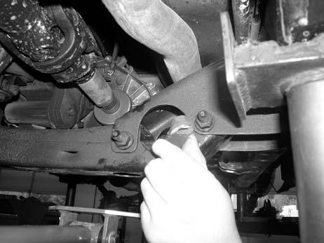 Repeat on the passenger side of the truck at this time. SEE PHOTO BELOW. Photo Shown Installing The Nut Tab Into The Frame. 52.