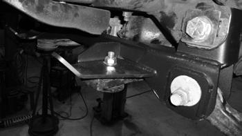 Figure 18b 39. Reinstall the rear cross member with the cams on the bolts.
