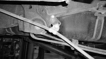 Figure 32 92. Install new rear brake line relocation bracket. Figure 33 Figure 33 93. 4" Rear Block Kit: Support the drive shaft.
