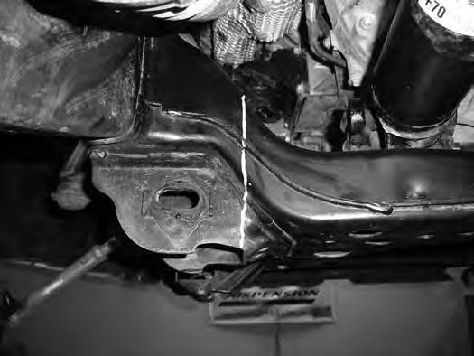 (parallel to the inside edge of the control arm