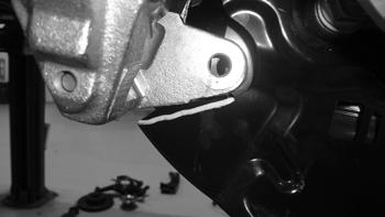 Figure 42 61. Attach the factory brake line bracket to the new steering knuckle with the original bolt.