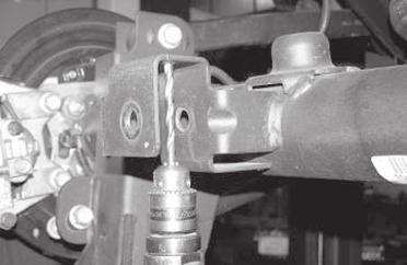 FIGURE 39 - STEP 25 26. Position the trac bar into the new trac bar bracket.