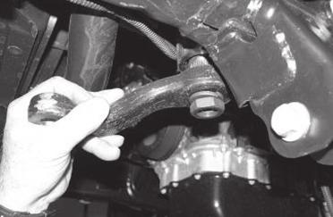 Use a pitman arm puller and remove the stock pitman arm. Discard the arm and save the nut and washer.