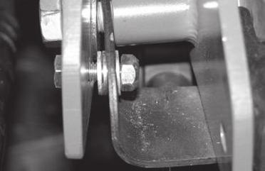 Take a 5/16 x 1 bolt with a flat washer and insert it into the outer bracket only.