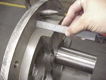 The bearing assembly must be complete and tight. Figure 24 2. Measure the distance between the rotor teeth and the outer face of the casing. Figure 24. 3.