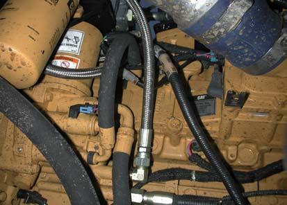 Both of these hoses will be fitted to the fuel filter later, (figure 6). 5. Remove the OEM belt tensioner from the OEM cast fan hub and alternator bracket, removed earlier.