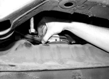 Carefully remove the tank support straps while supporting the tank with a jack or a helper. Use caution, as some fuel will be remaining in the fuel tank. 3. Fuel Pump Replacement: A.