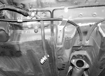 Figure 13 - Factory Fuel Line Removed 2. To provide enough clearance to fit the fuel supply and return lines, we removed a tab from the fuel line support clips (See Fig. 14). 5.