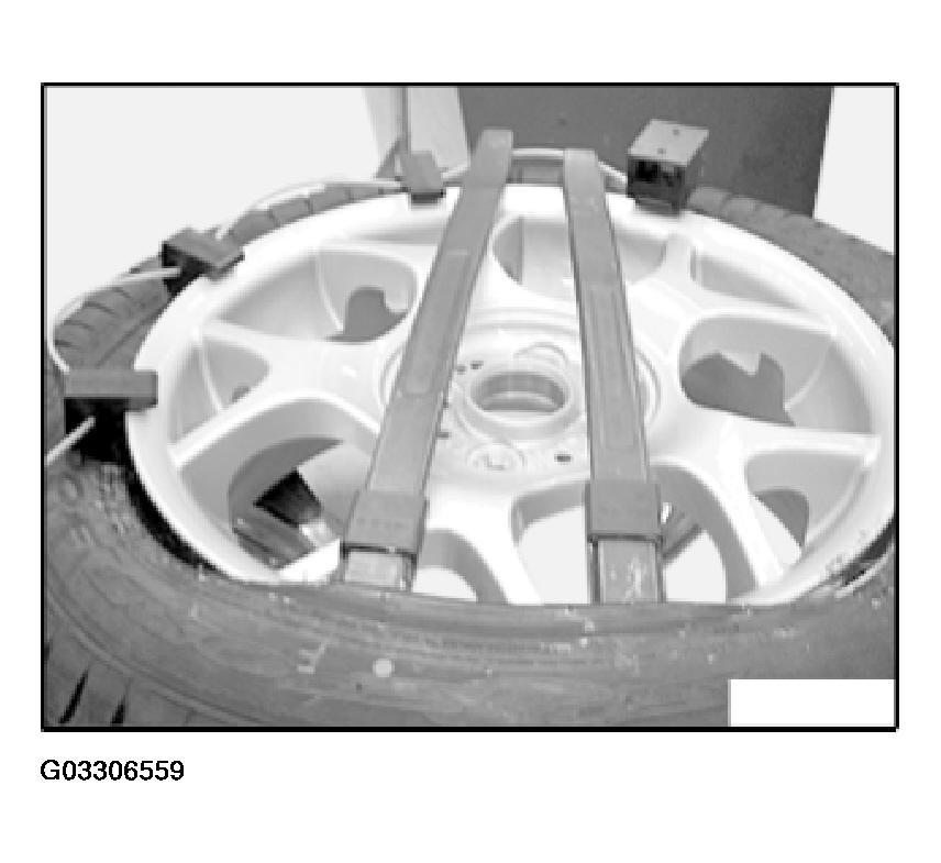 Fig. 22: Identifying Tire Bead, Special Tools And Rim Flange Swivel or tilt fitting head into position and allow it to snap into place.