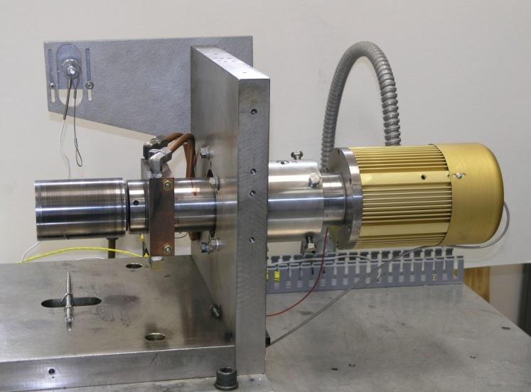 section of wire cable. A data acquisition system controls the motor and collects speed and temperature data. Figure 2. Slow-speed foil bearing test rig. 5.