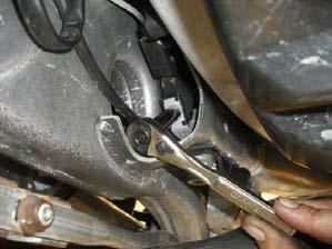 8. REMOVE THE LOWER SHOCK BOLTS.
