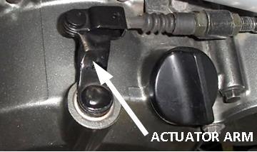 Locate the two jam nuts at the clutch cable support bracket.