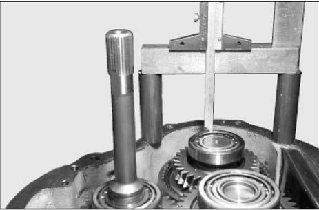 Shimming of Transmission Shaft Assembly 1. Assemble shaft assembly (including taper bearing cone and cup). 2. Insert shaft assembly into transmission case. 9.