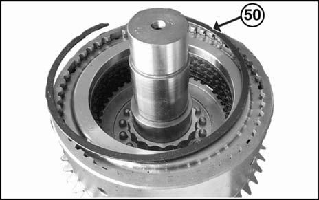 17. Install the pressure plate in the cylinder. 18. Assemble the snap ring (50) which sets the pressure plate in the cylinder, using a screw driver. 19.