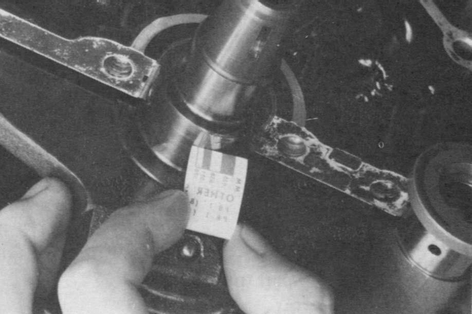 16 Four-Stroke Engine Lower-End Inspection FIGURE 4 Measure the crankshaft journal with plastigage. (Courtesy Kawasaki Motor Corp., U.S.A.