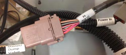 The rate controller has two harness connections. The first is the connection to the Trimble wiring harness that connects to the in-cab display.