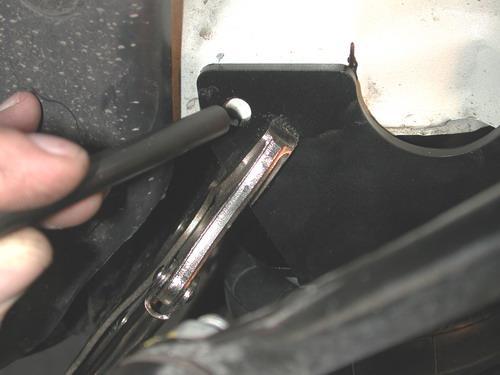 8. Hold the air spring assembly up to the coil spring pocket.