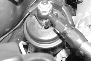 Install the banjo end to the fuel filter using the factory banjo bolt and the supplied 12mm crush washers. Use one washer on each side of the banjo fitting (See Fig. 5).