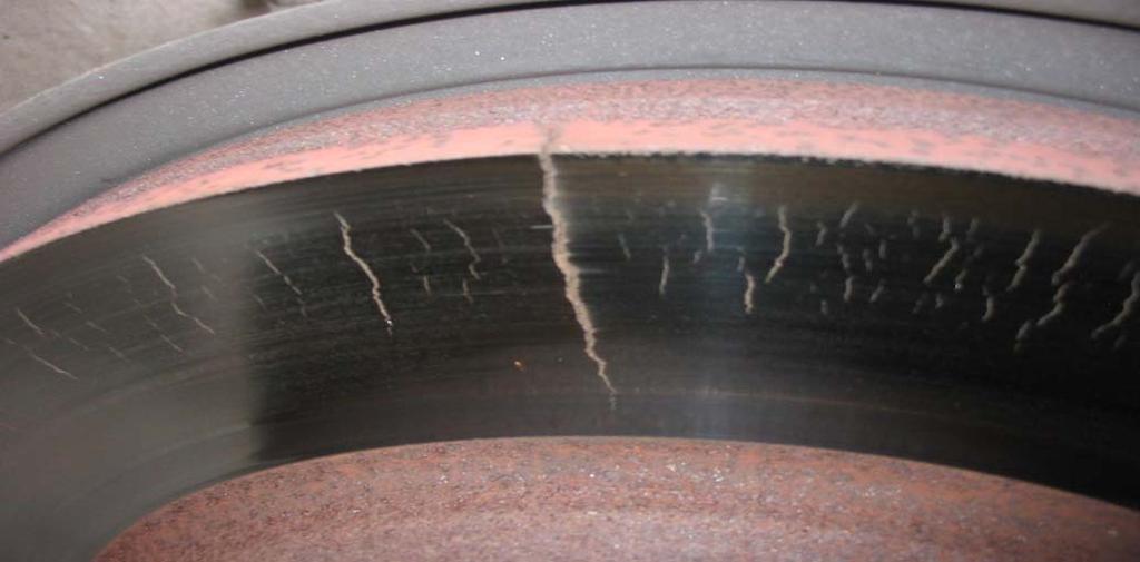 5 Short radial cracks on the rotor surface that comes into contact with the brake pads ( heat checking ) is caused by heating and cooling of the disc during normal operation.
