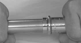 NOTE: The tool will not work unless the pin is fully engaged. Crimping a NIBCO Press System Fitting or Valve 1.