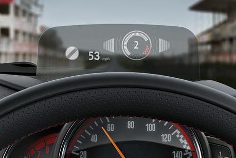 The optional MINI Head-Up Display (3) projects key driving data into your field of view without disrupting your view of the road ahead, so you