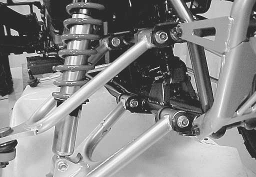 CHASSIS 6-35 Install the wishbone arms to the steering knuckle and tighten the knuckle end nuts to the specified torque. # Knuckle end nut: 43 N m (4.3 kgf-m, 31.0 lb-ft) Install the cotter pins.