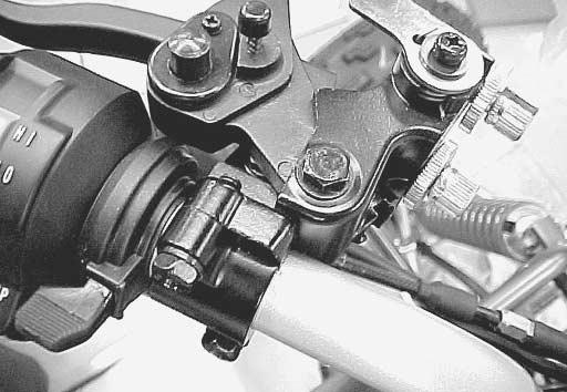 8-11 to 8-20) Install the clutch lever assembly to the handlebars with the mating surface of clutch lever holder aligned with