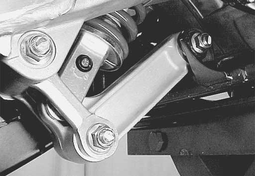 Tigten the rear shock absorber mounting nuts to the specified torque. # Rear shock absorber nut (Upper) 1: 60 N m (6.