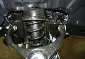 (Fig 12) Raise the lower control arm up until the upper ball joint can be fully installed into the knuckle.