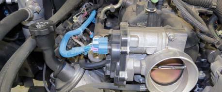Remove coolant hoses from the throttle body. 11.