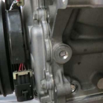 Remove the rear engine support brace attached to the rear of the
