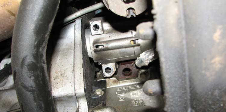 31. Apply thread sealant w/ PTFE to the threads on the plug removed from the engine block and install it to the factory oil sensor location. NOTE: DO NOT use Teflon tape as it will not seal properly.
