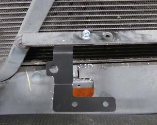 brace approximately 1-inch left of the accessory cooler mounting hole or the left ambient