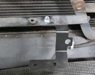 Using four (4) M6 x 10 bolts from bag #2, mount the lower LTR brackets to the lower LTR bungs