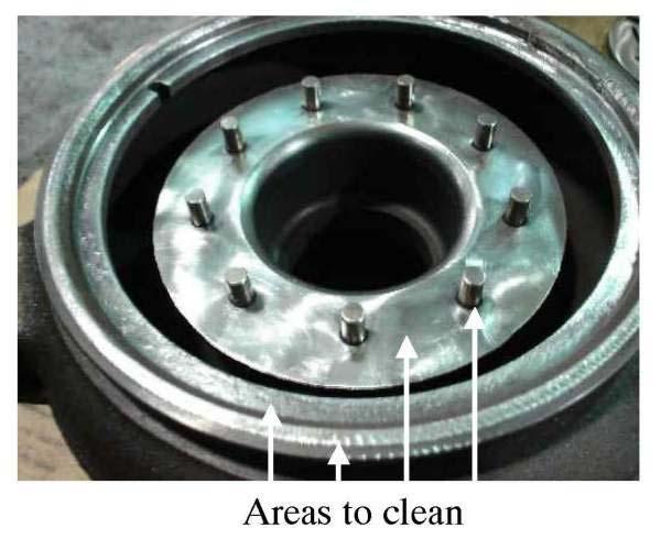 Take care to prevent damage to the machined surfaces and housing vane posts. Remove debris from the housing with brake cleaner and compressed air. Figure 15 17.