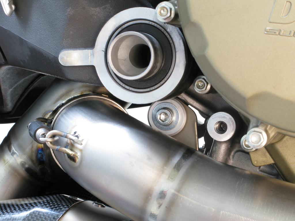the motorcycle and tighten the mufflers