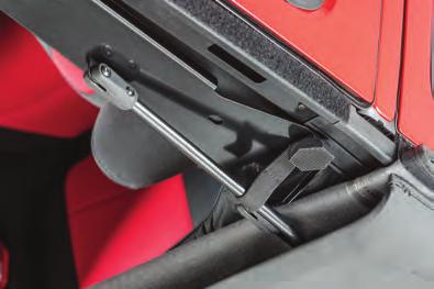 the strap perpendicular to the fold back link on the adventure top. Figure 56 Figure 57 Strap installed in driving position.