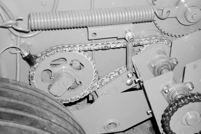 If needed, a link can be removed from the chain. When the idler no longer applies tension to the chain, and the chain has had a link removed, the chain is worn and must be replaced.