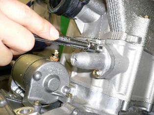 Remove bolts and take out Cam Support.