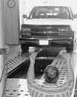When raising or lowering machine with vehicle aboard, DO NOT walk behind machine. 7. DO NOT exceed 12,000 lbs.