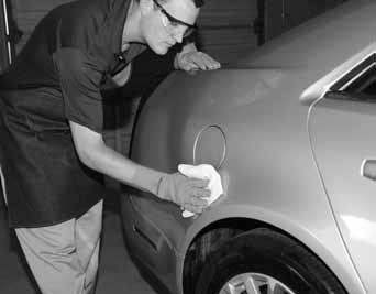 Polish the painted surface with a high speed buffer and polishing pad.