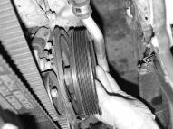 15) Remove power the steering pulley and also loosen the power steering pump bracket in order to gain access to the upper most water pump bolt. There will be three fasteners total.
