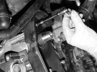 ) Remove the bolts and pulleys from both camshafts, keeping track of which one belongs with which side. These are tapered camshafts and do not have any type of key.