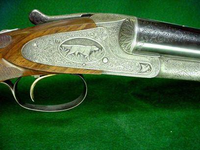was described in the 1900 catalog: "Regularly the A-3 Automatic Ejector is engraved with a setter dog in the left lock plate and a pointer in the right, in relief.