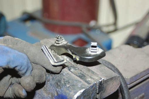 Using a 1 1/16 and a 1 3/16 wrench loosen the tie-rod end from inner tie-rod as shown in Photo 5. Remove cotter key from tie-rod end.