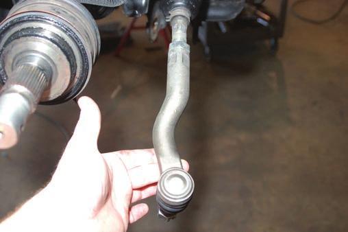 16. Remove sway-bar using a 17mm wrench. 17. Swap left and right outer tie-rod ends as shown in Photo 13. This is done for wheel clearance.