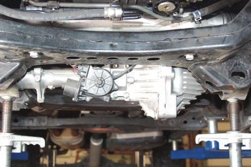 Lower differential down being careful with vent hose and wiring. Let the diff rotate down slightly. (4WD Model) See Photo 15. 21.