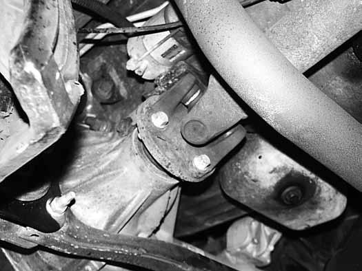 Remove the CV axle from hub. 18. Remove the lower ball joint nut and remove the knuckle from the lower control arm. Retain the ball joint nuts. 19.