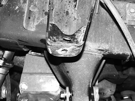 Fig 13b 30. Install the provided passenger s side differential drop bracket (01234) to the original frame mount with two ½ x 2-3/4 bolts, nuts and ½ SAE washers (BP #617).